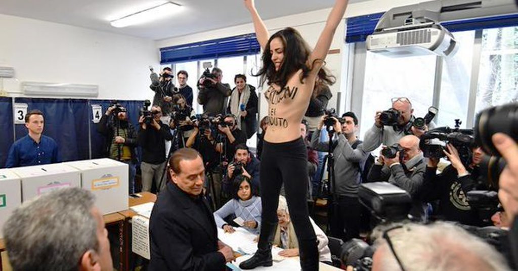 Elezioni, Berlusconi contestato al seggio da una ragazza a seno nudo [VIDEO]